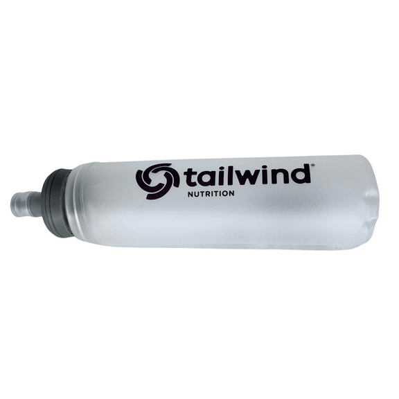 Tailwind Nutrition clear soft flask water bottle with black logo on white background