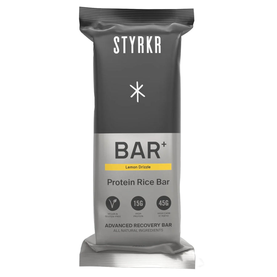 STYRKR BAR+ Lemon Drizzle protein rice bar in grey packaging with nutritional info