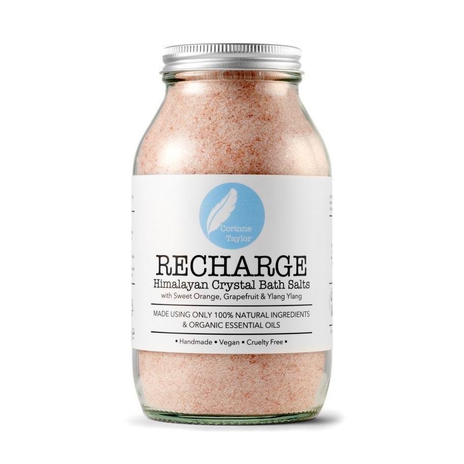 Glass jar of RECHARGE Himalayan Crystal Bath Salts with sweet orange and grapefruit
