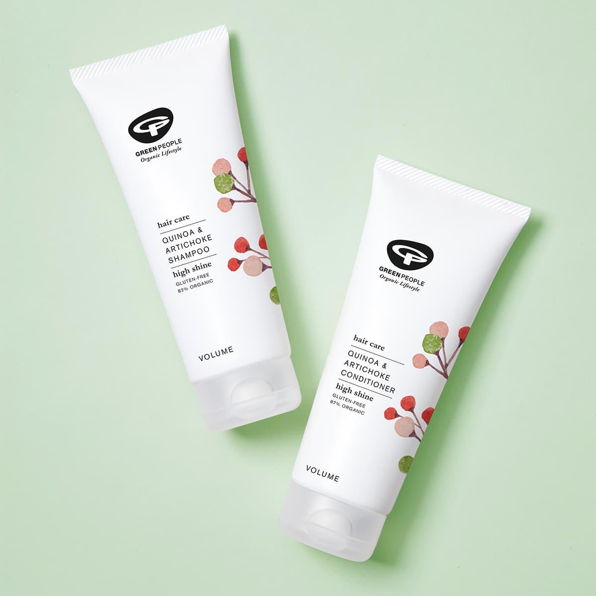 Green People Quinoa & Artichoke shampoo and conditioner tubes on light green background