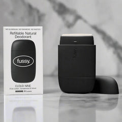 Fussy Cloud Nine refillable natural deodorant with box on marble surface.
