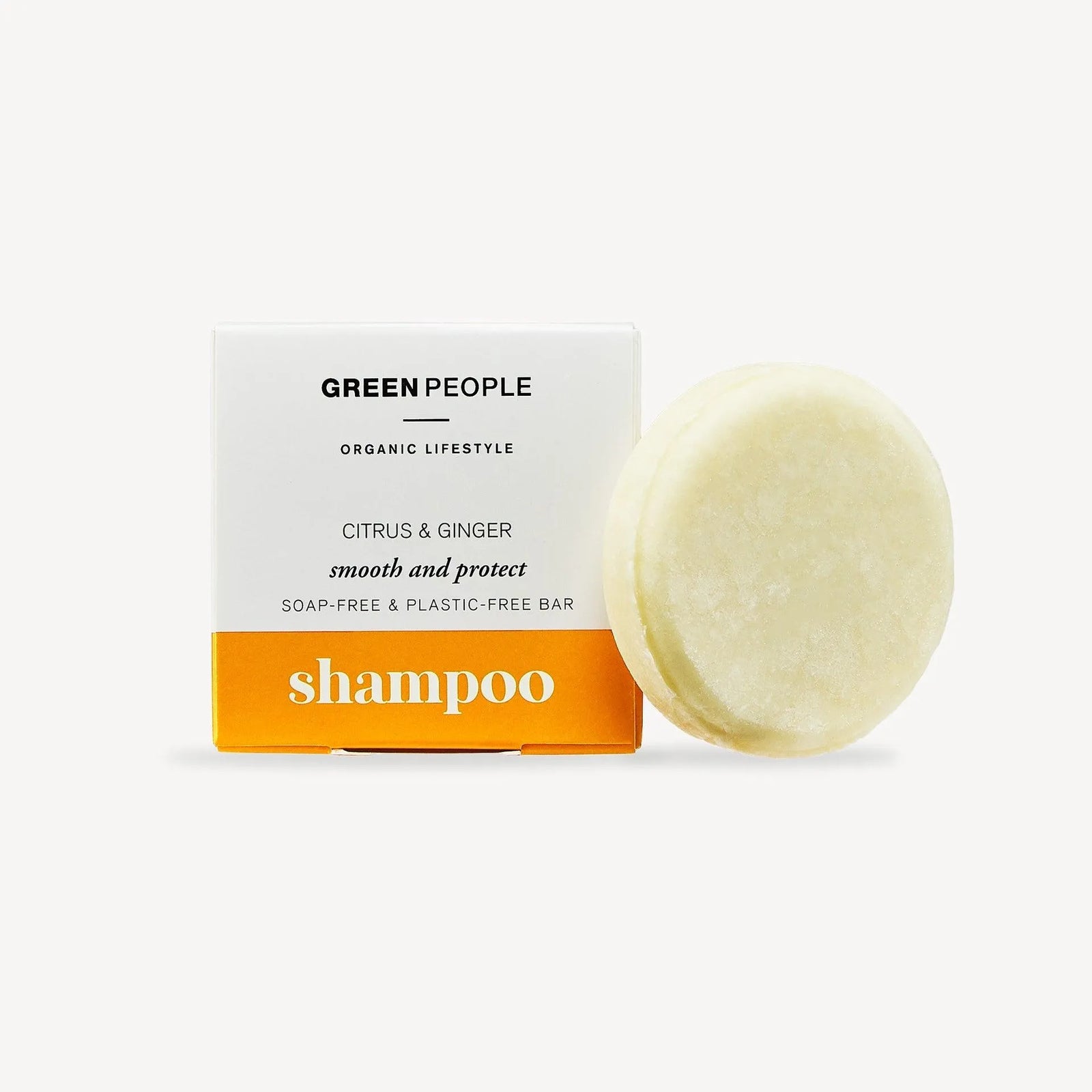Green People citrus and ginger shampoo bar with white packaging and orange label