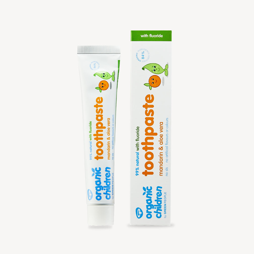 Organic Children mandarin aloe vera fluoride toothpaste tube and box on white background