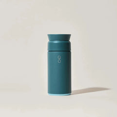 Forest green insulated reusable water bottle on light background