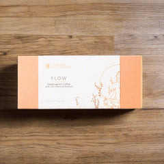 London Nootropics Flow adaptogenic coffee box with Lion’s Mane and Rhodiola on wood background