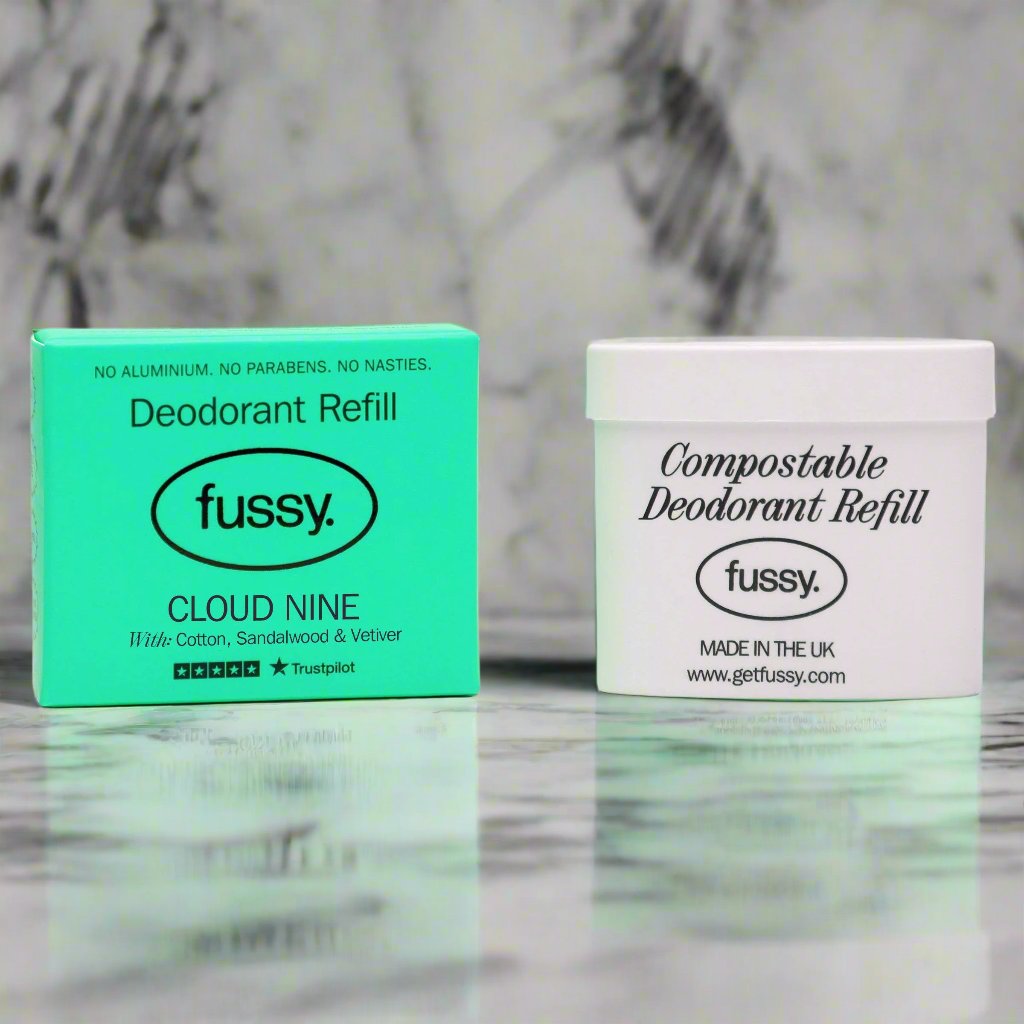 Fussy Cloud Nine deodorant refill and compostable refill tub on marble surface
