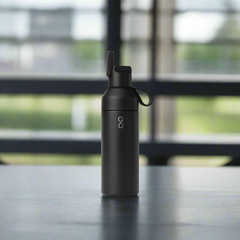 Black water bottle with a logo on a white background