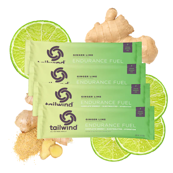 Tailwind Endurance Fuel ginger lime packets with fresh ginger and lime slices