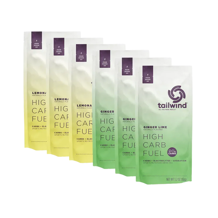 Six Tailwind High Carb Fuel drink mix packets, Lemon and Ginger Lime flavors, upright