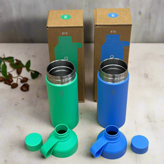Green and blue reusable water bottles with lids, eco-friendly packaging, on table