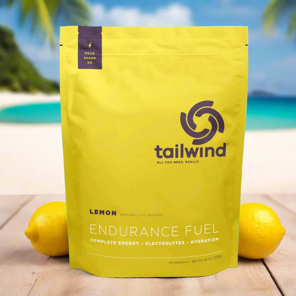 Tailwind lemon endurance fuel powder pouch with lemons on a beach background