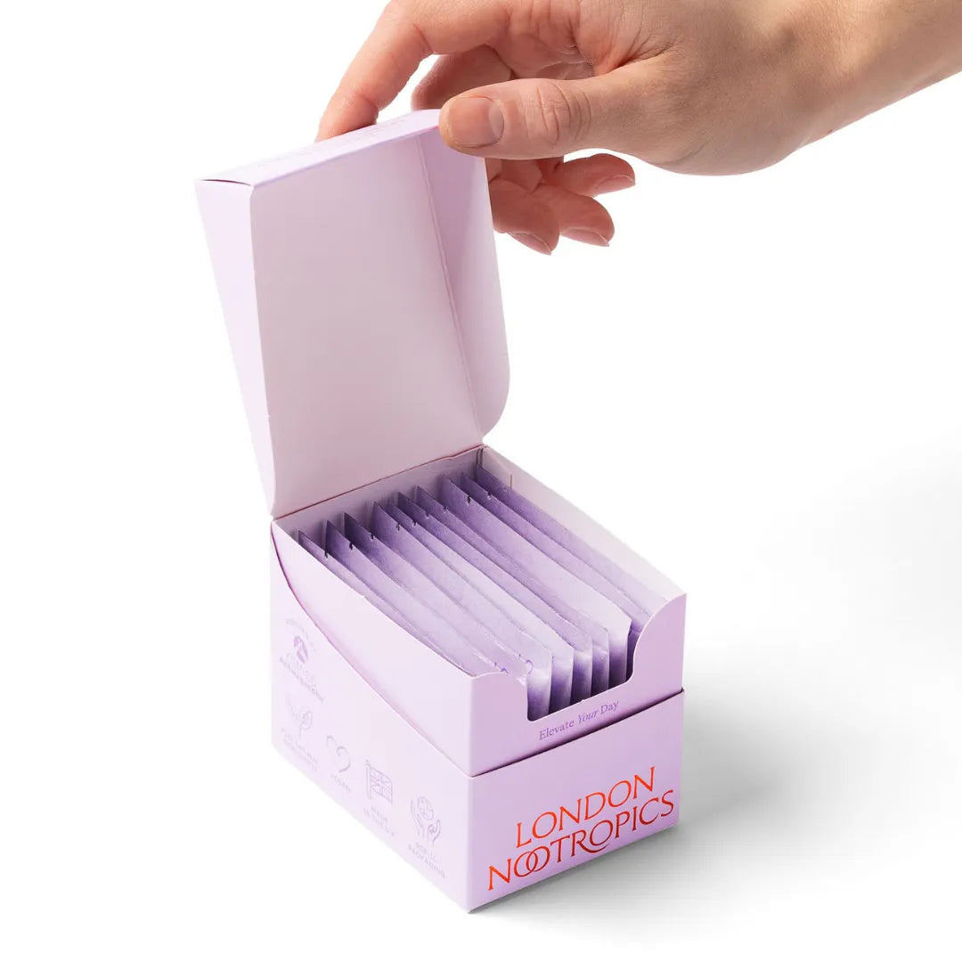 London Nootropics Zen Coffee sachets in open lavender box, hand reaching in
