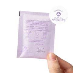 Hand holding London Nootropics Zen coffee sachet with KSM-66 Ashwagandha ingredients label