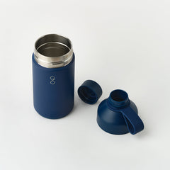 Ocean Bottle 750ml insulated water bottle in ocean blue with detachable lid on white background