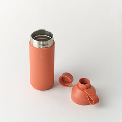 Sahara red reusable water bottle with open stainless steel lid and detached cap on white background