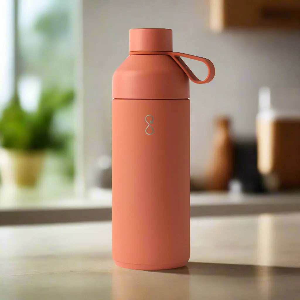 Sahara Red insulated water bottle with handle on kitchen counter