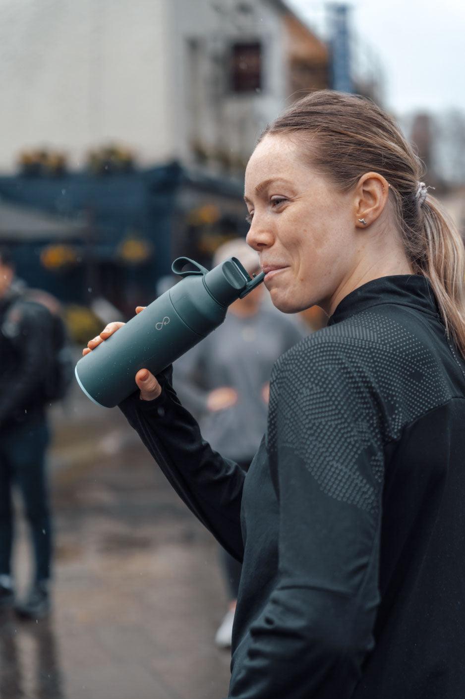 Reusable bottle ready beside outdoor endurance equipment