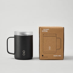 Ocean Bottle black travel mug with handle and packaging on white background
