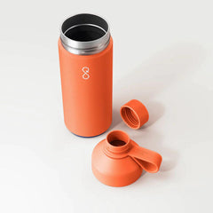 Sunshine orange Ocean Bottle reusable water bottle and lid on white background