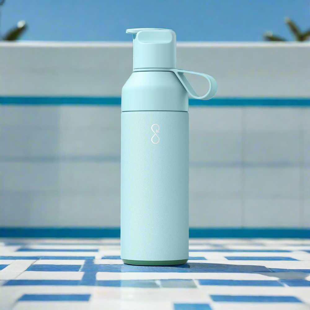 Light blue water bottle with a handle on a light grey background