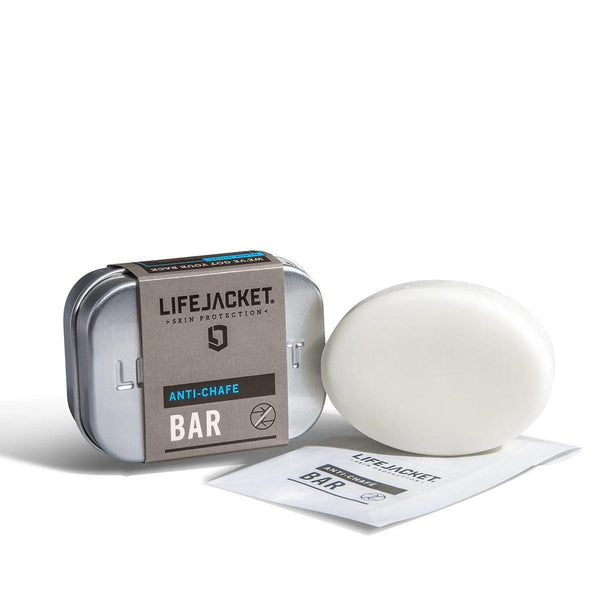 LifeJacket Anti-Chafe Bar with metal travel tin and white solid bar on white background