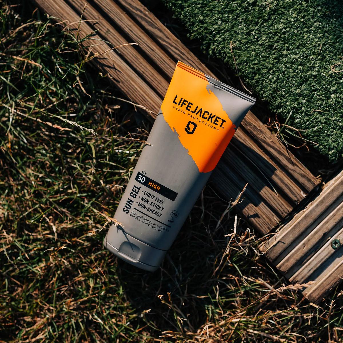LifeJacket SPF 30 sun gel tube on grass and wood outdoor setting