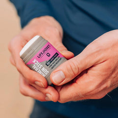 Hands holding the LifeJacket Mineral Sun Stick SPF50+ before outdoor use