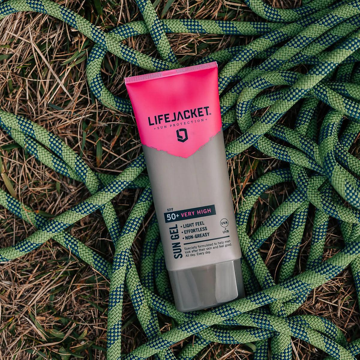 LifeJacket SPF 50+ Sun Gel tube on grass with green climbing rope outdoors