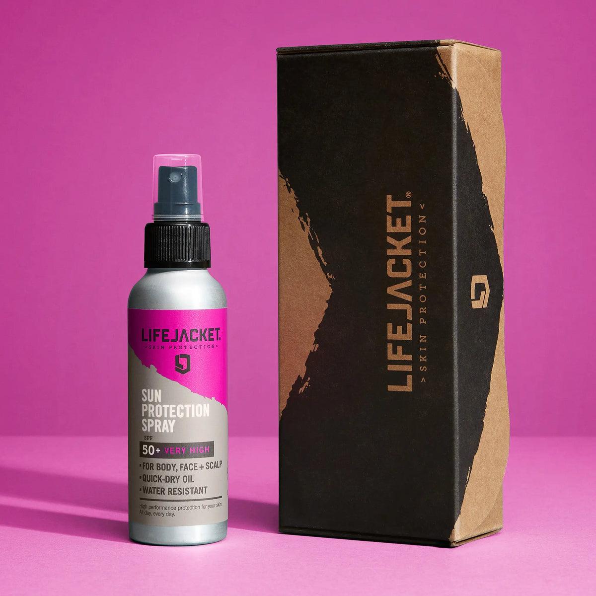LifeJacket SPF 50 sun protection spray with packaging on pink background
