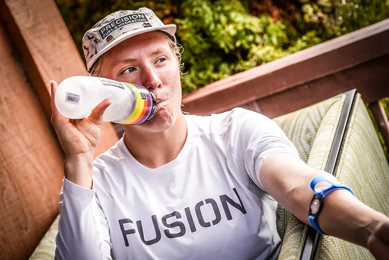 Endurance athlete holding a marked bottle during hydration testing