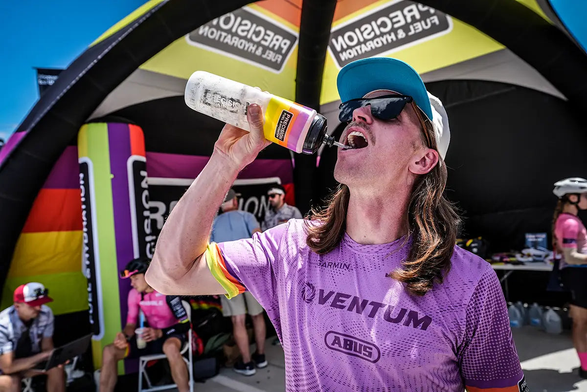 Cyclist carrying a measured hydration bottle during an endurance event
