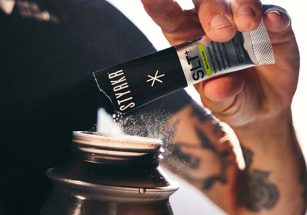 Measured electrolyte drink being mixed for endurance training