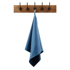 Wall-mounted wooden coat rack with five black hooks and a blue towel hanging