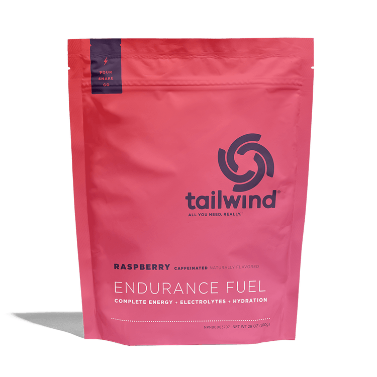 Tailwind Endurance Fuel Raspberry caffeinated energy drink mix pink resealable bag.