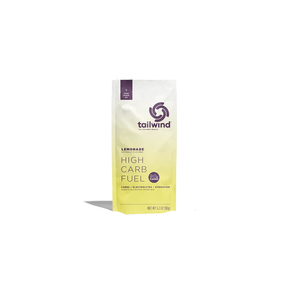 Tailwind Lemonade High Carb Fuel sports drink mix pouch front view, white and yellow packaging
