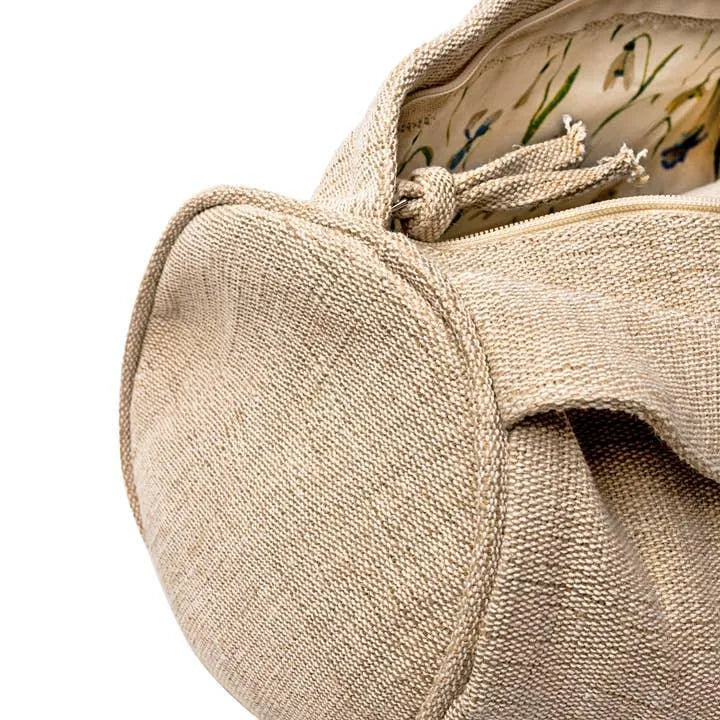 Natural linen textured bag with floral print lining and fabric tie closure
