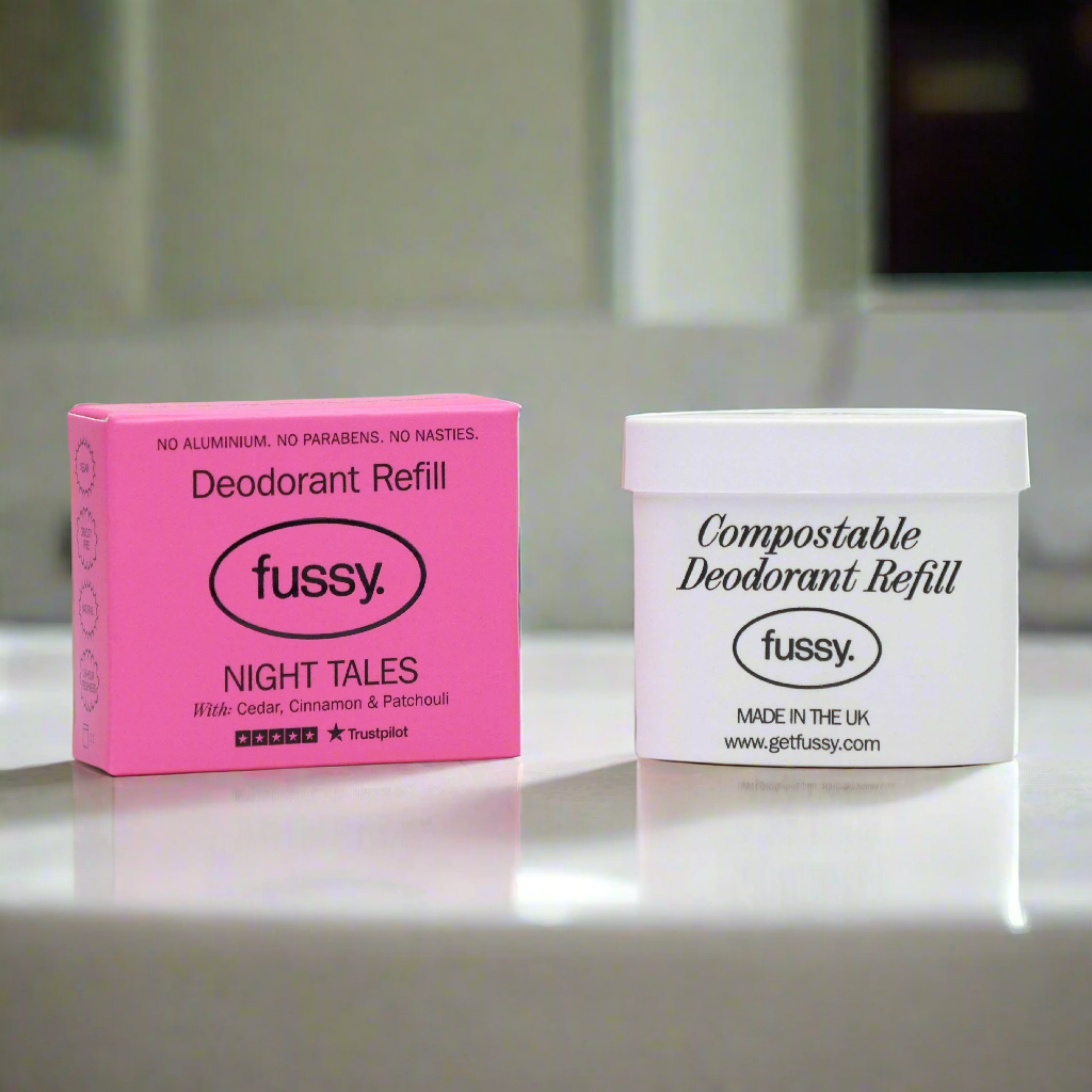 Fussy Night Tales deodorant refill in pink box and compostable refill tub on bathroom counter