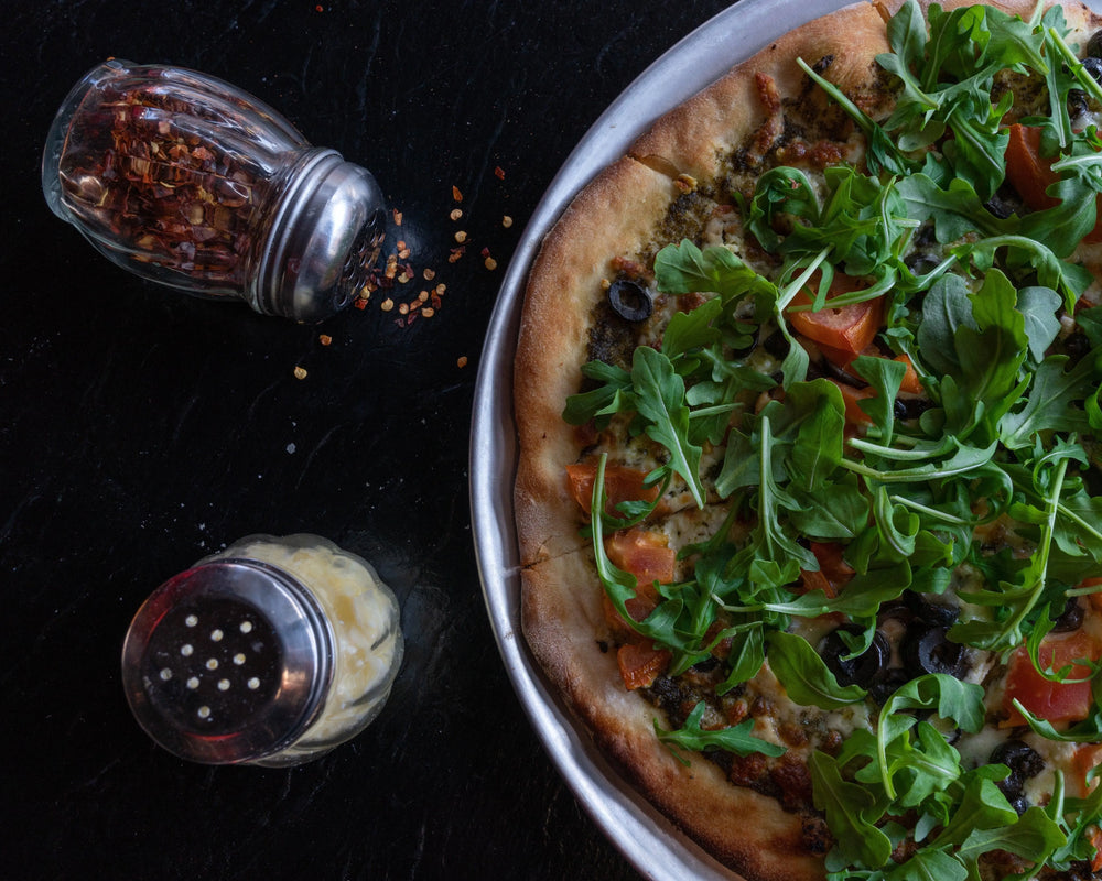 Fresh pizza served in a pan
