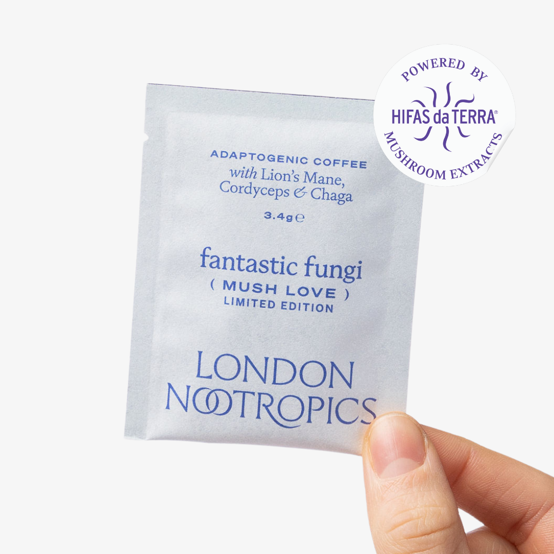 Hand holding a London Nootropics Mush Love coffee sachet