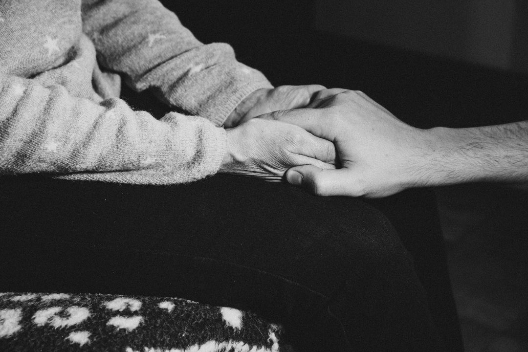 monochrome-image-of-person-holding-someones-elses-hand - Ready Sweat Go