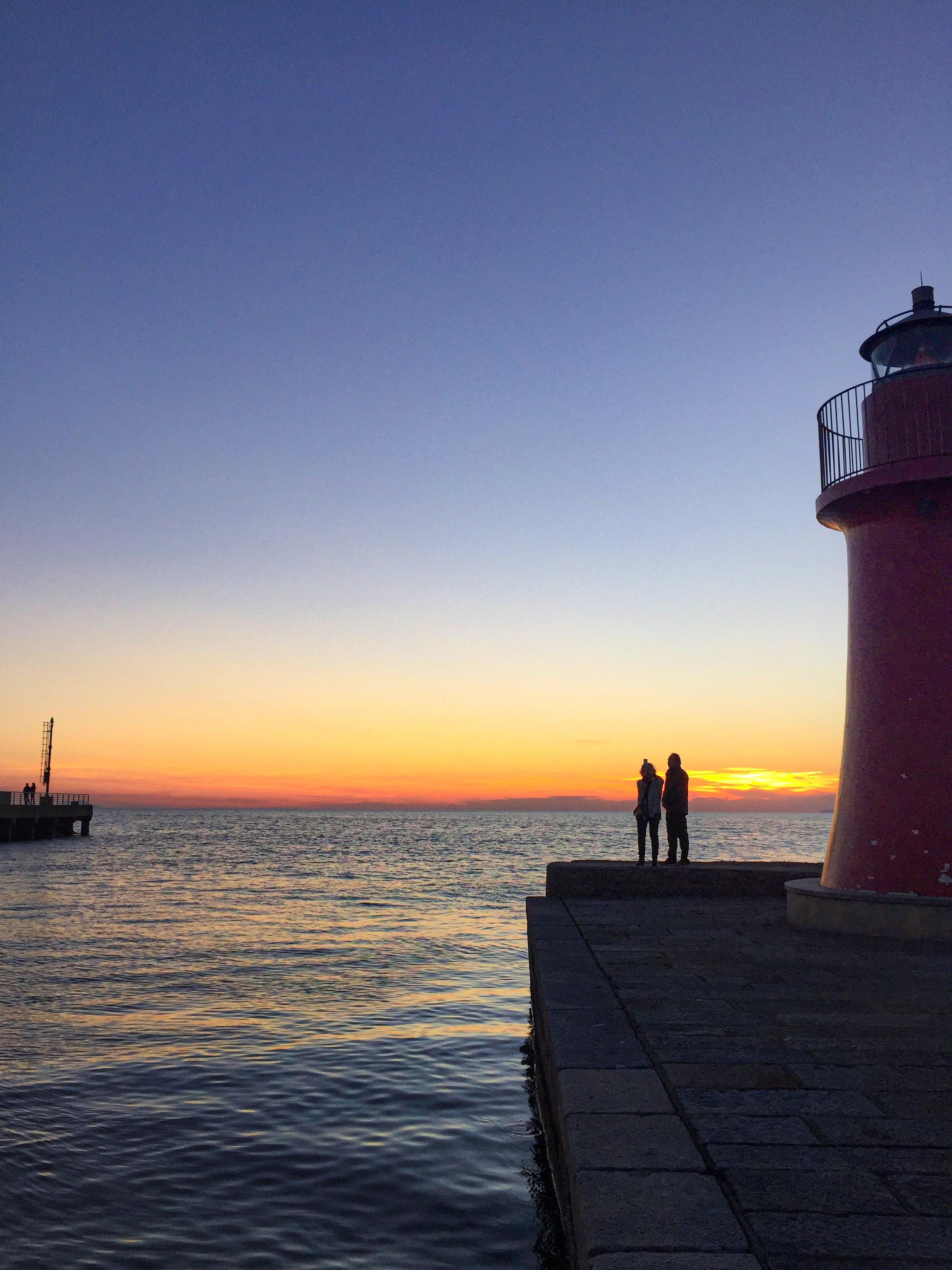 people-enjoy-blue-hour-by-the-water - Ready Sweat Go