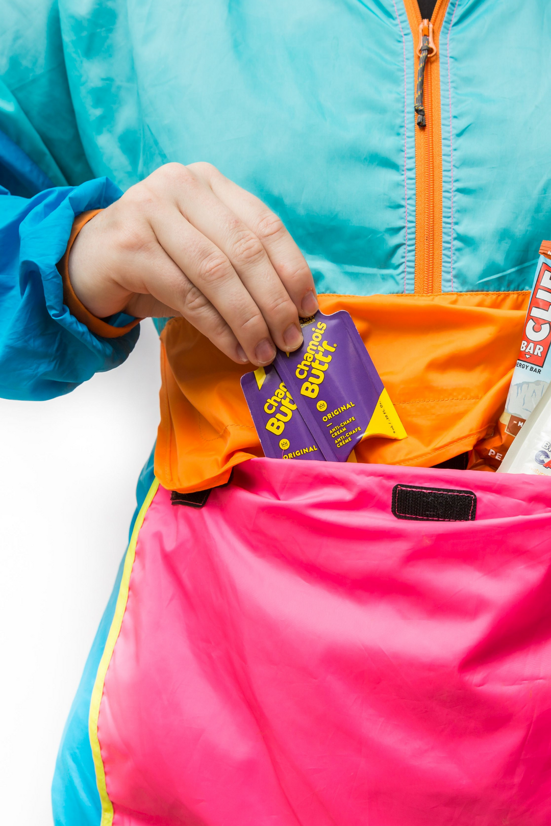 Chamois Butt'r Original sachets carried in colourful running kit
