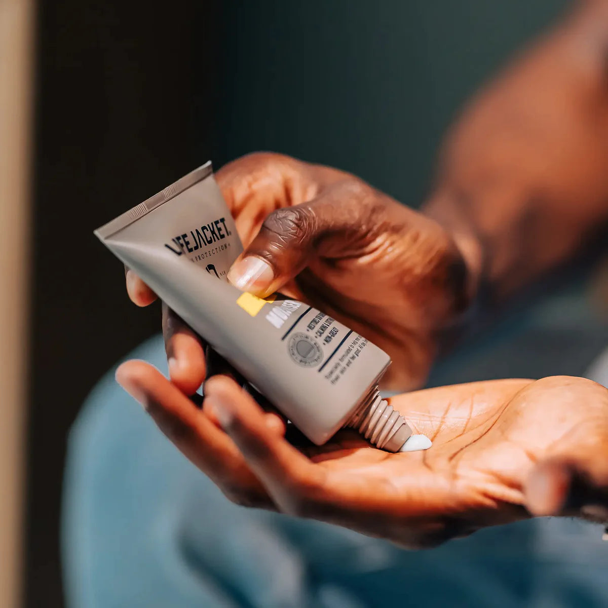 LifeJacket Daily Repair Moisturiser being applied to the hand after an active day