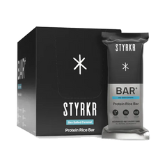 STYRKR BAR Plus Salted Caramel box of 12 and bar on transparent background