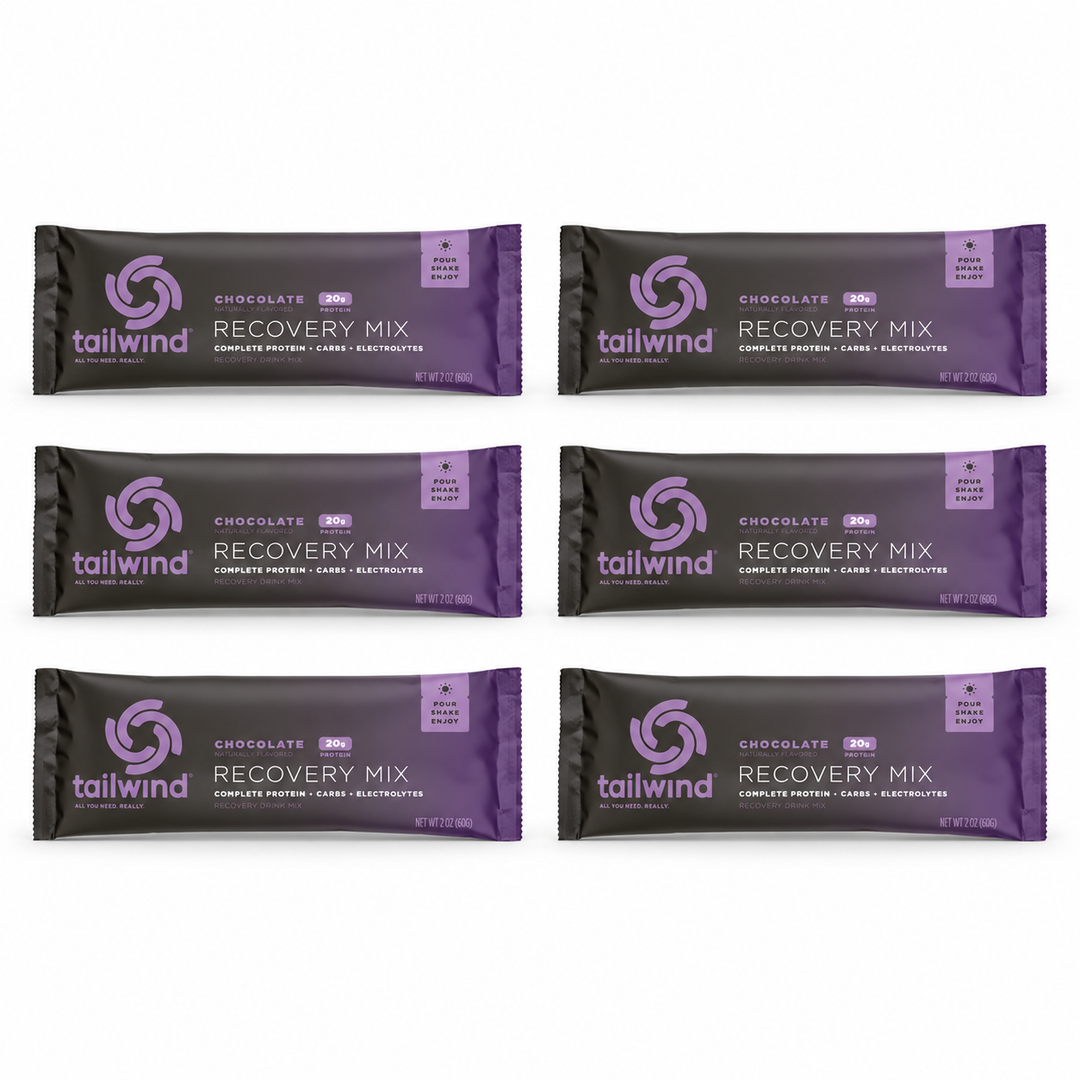 Six Tailwind chocolate Recovery Mix sachets.