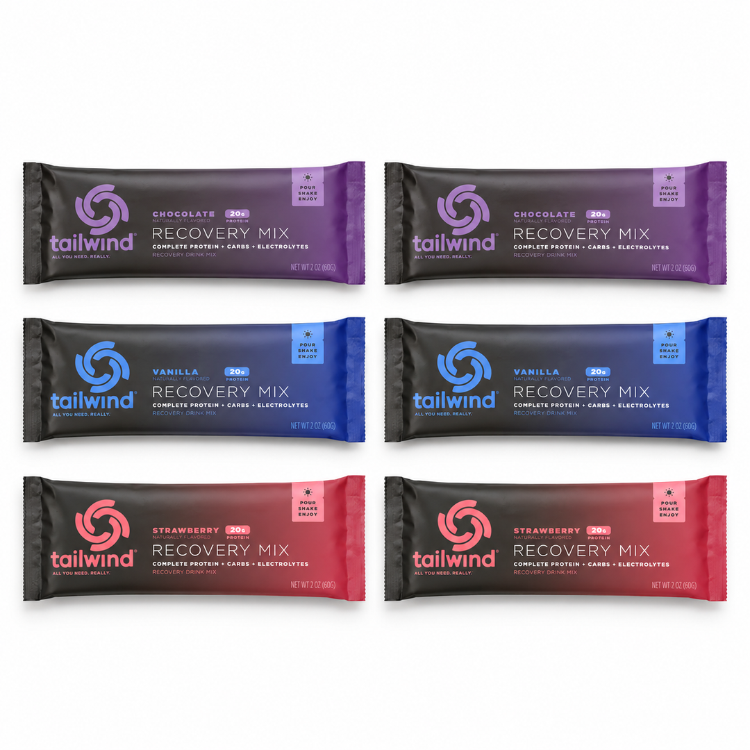 Six Tailwind Recovery Mix sachets: two Chocolate, two Vanilla and two Strawberry.