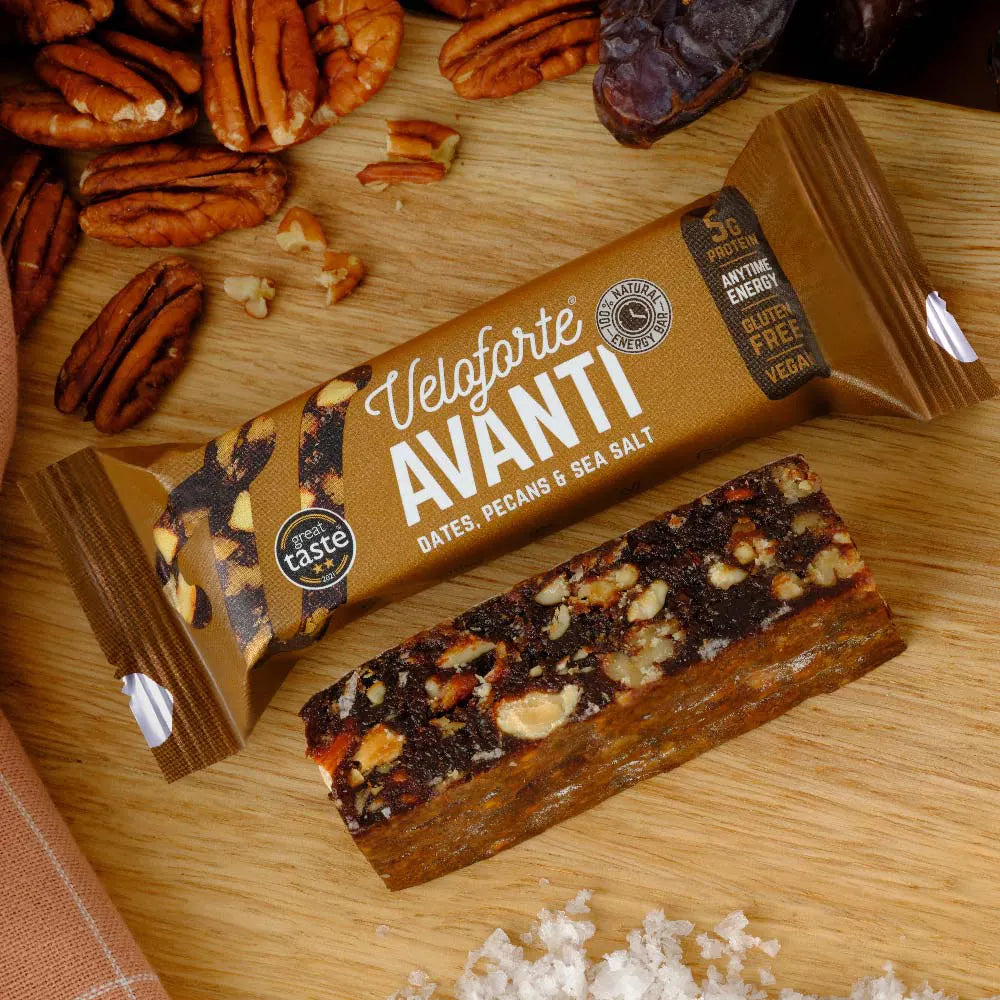 Veloforte Avanti energy bar with dates, pecans, sea salt on wooden board