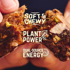 Close-up of soft, chewy plant-based energy bar with visible nuts and bold text overlay