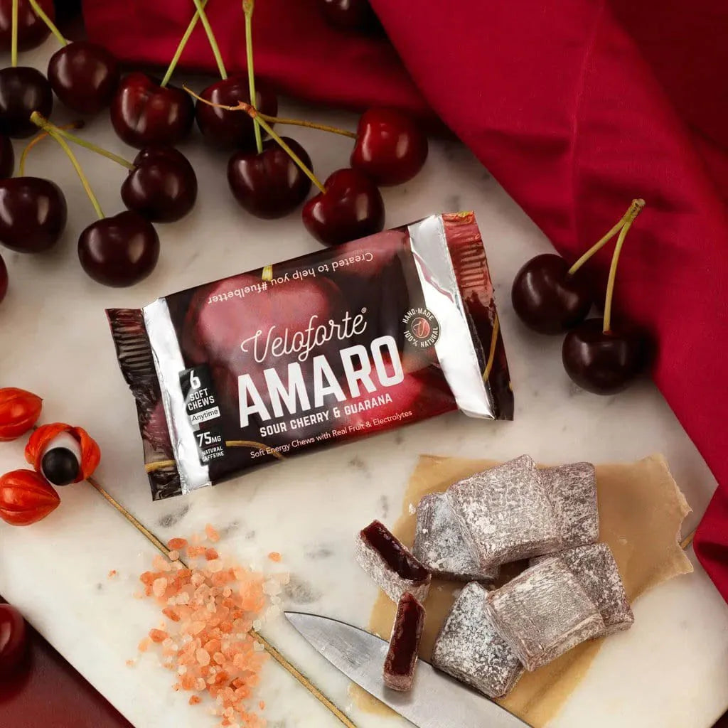 Veloforte Amaro natural energy chews with sour cherry, guarana, and fresh cherries on marble