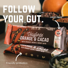 Veloforte Orange &amp; Cacao energy bars with seeds, oats, and orange, featuring high fibre and prebiotics.